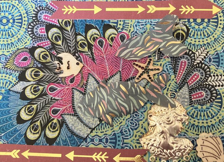 A postcard collaged with blue and gold patterned paper and overlaid with peacock feather patterns, tiny wooden shapes of an angel fish, a starfish and a shell, a small metallic shape of a head, 2 fish cut out of grey, gold, green and bronze flecked paper and tape with gold arrows.
