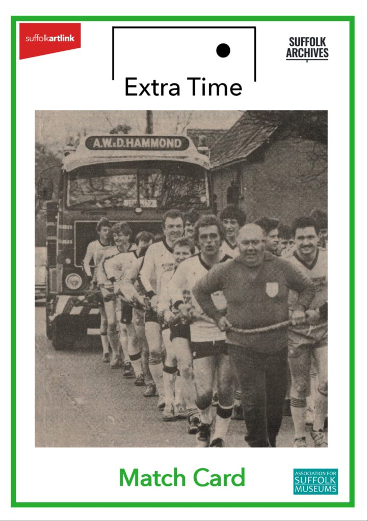 A monotone photograph of a team of men dressed in football kit with a length of rope around them, pulling a A.W.D. Hammond's pick up truck