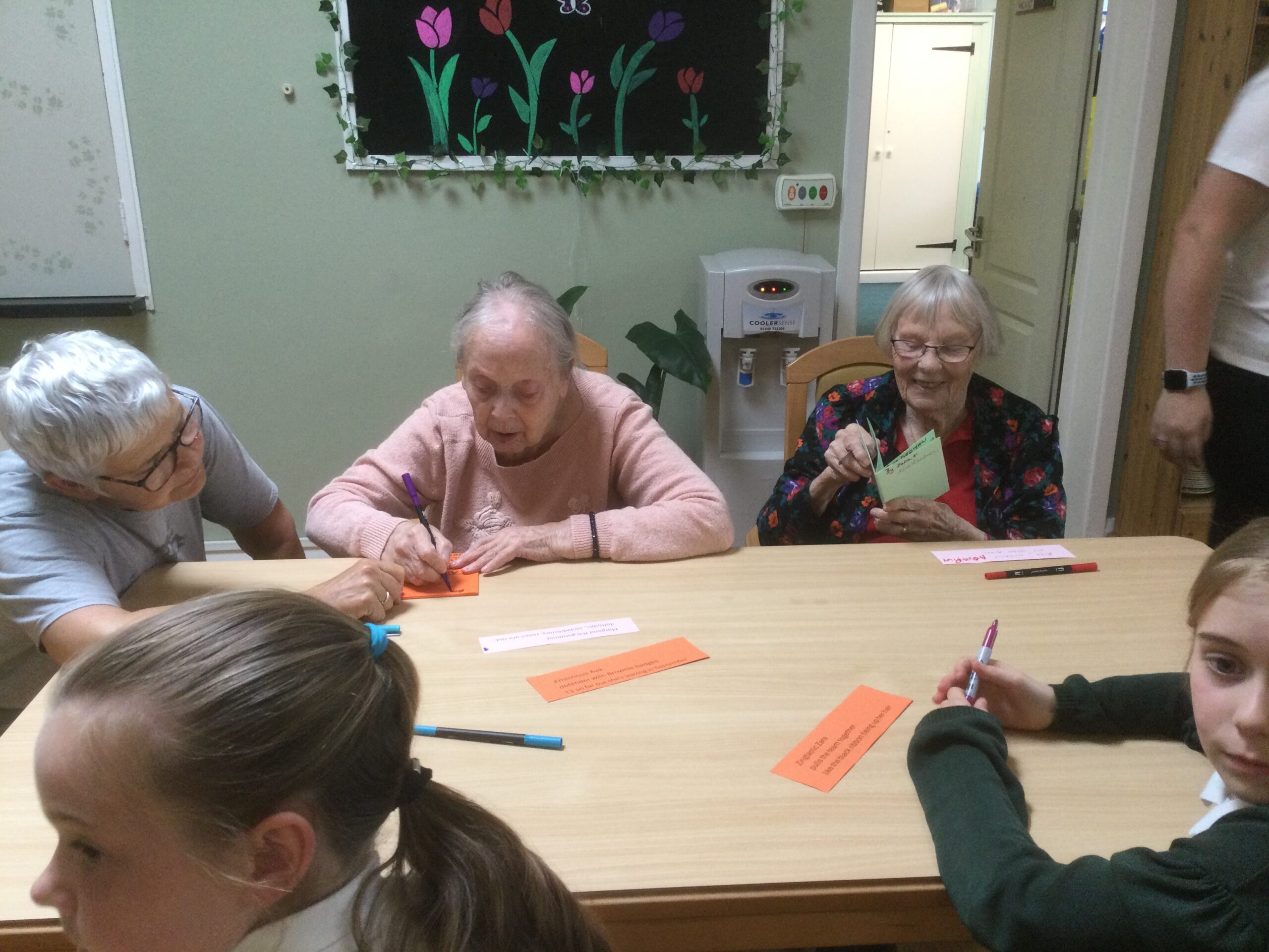Residents reading hand made booklets