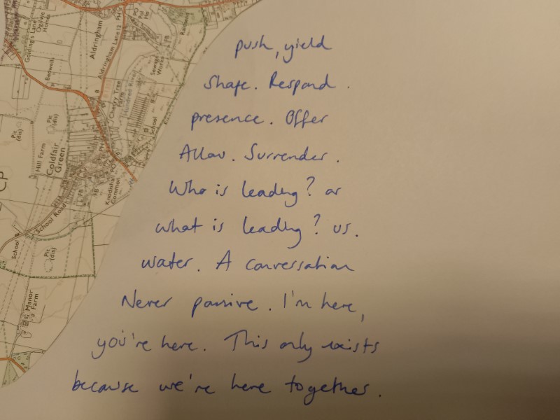 a coastal map with a word poem: "“Push. Yield. Shape. Respond. Presence. Offer. Allow. Surrender. Who is leading? Or what is leading? Us. Water"