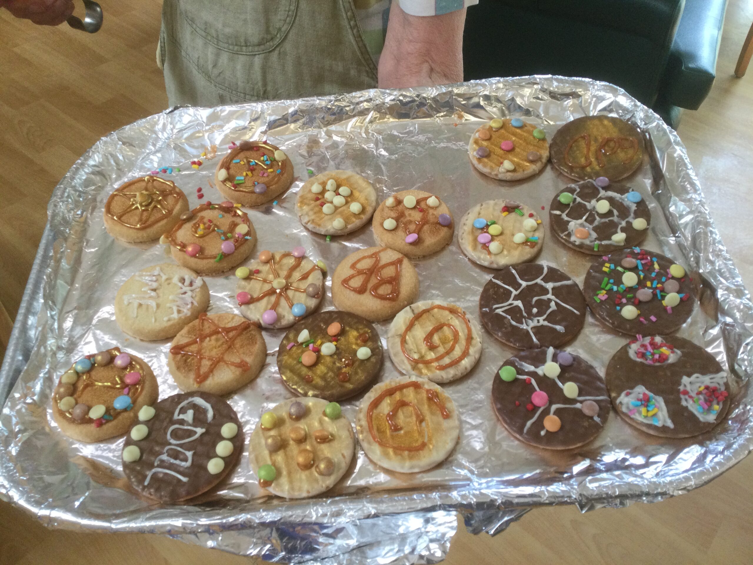 A silver platter of decorated biscuits