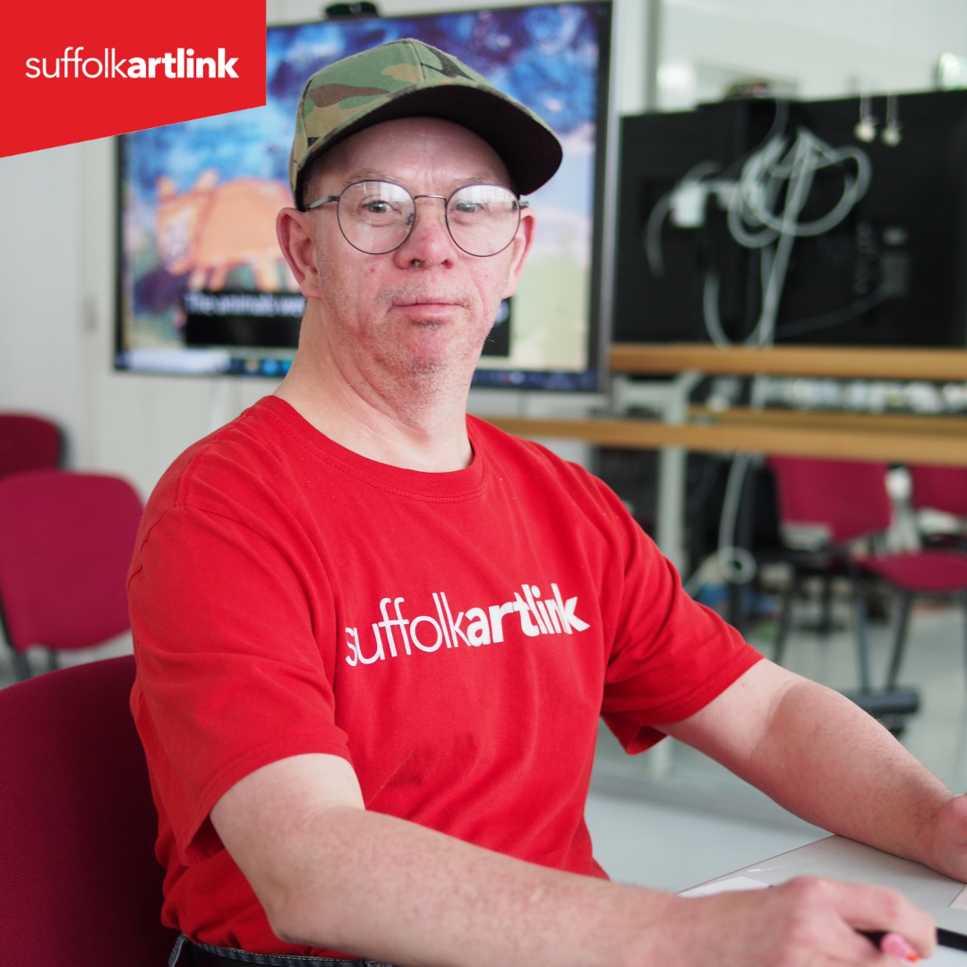 man wearing red T-Shirt and cap