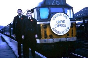 2 people in front of charetered train