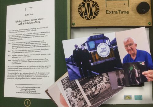 Interior of story box, showing a small selection of the images, including two men standing at the front of a train with Lowestoft Town Supporters Club Orient Express written on the front