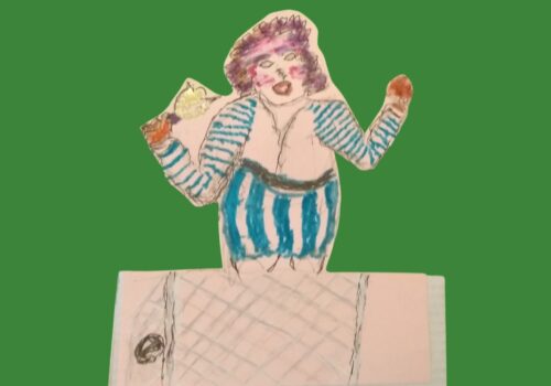 A cardboard figure in blue and white stripes holding a bell in her right hand with a net and football in front of her