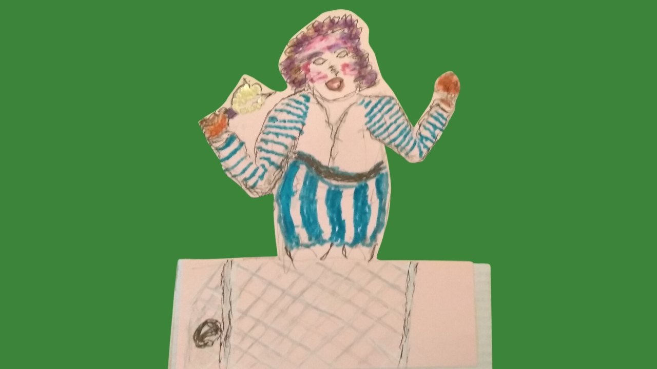 A cardboard figure in blue and white stripes holding a bell in her right hand with a net and football in front of her