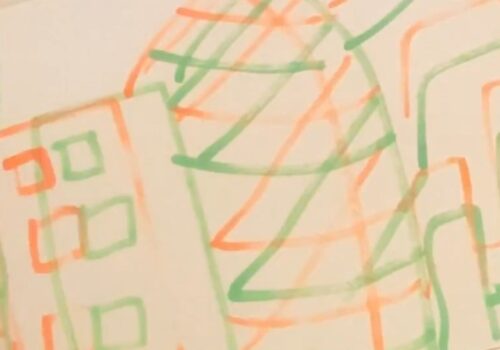 Cityscape drawn in orange and green pen.